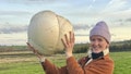 Alissimon Minnitt with the giant mushroom she found while on a hike with her dad. - Fox News