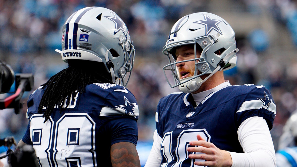 CeeDee Lamb celebrates with Cooper Rush