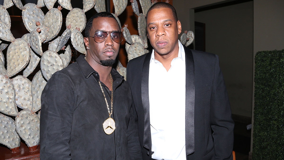 Diddy and Jay Z Stand to the other