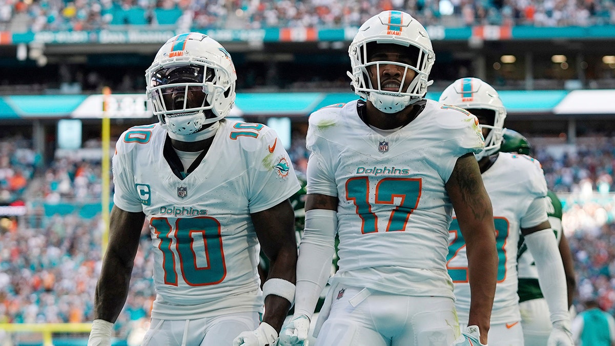 Tyreek Hill and Jaylen Waddle celebrate