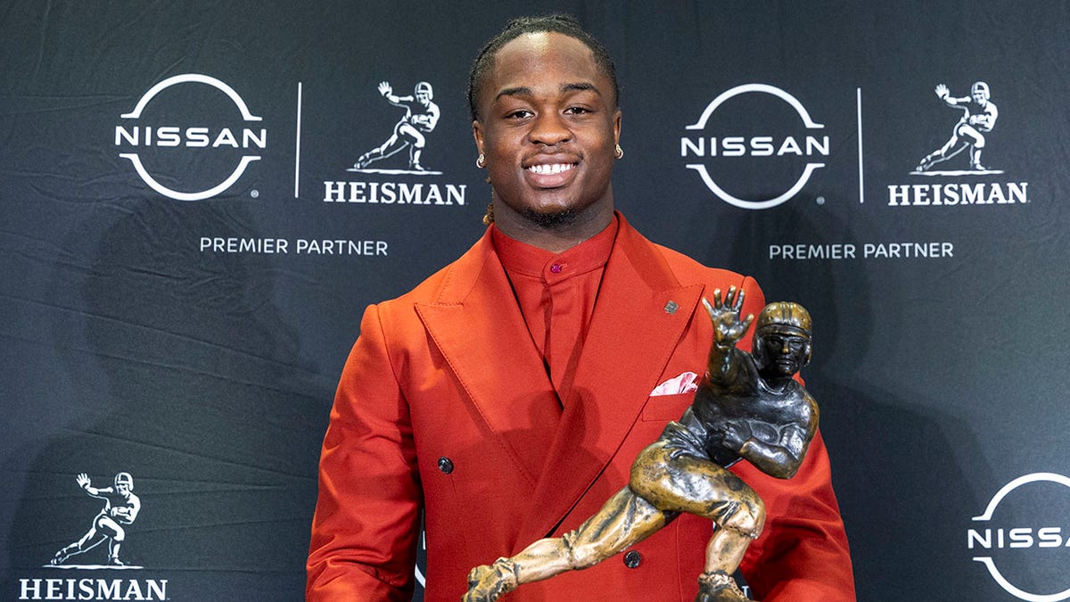 Ashton Jeanty with the trophy