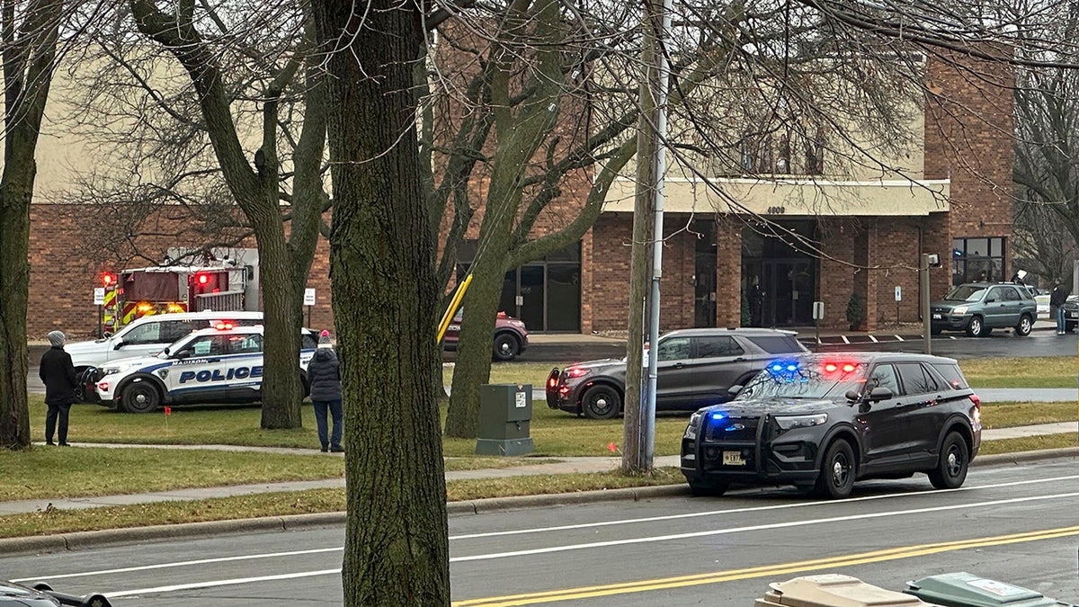 Emergency vehicles are parked outside the Abundant Life Christian School i