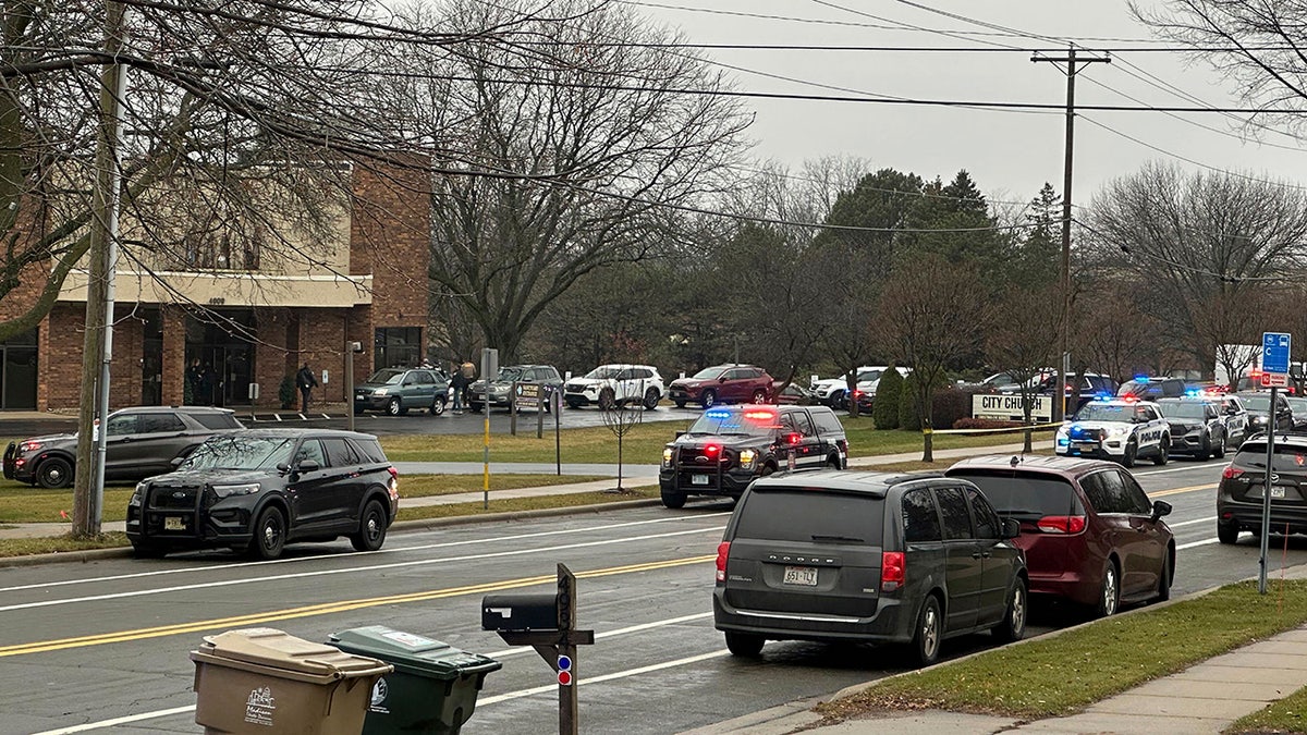 Emergency vehicles are parked outside Abundant Life Christian School i