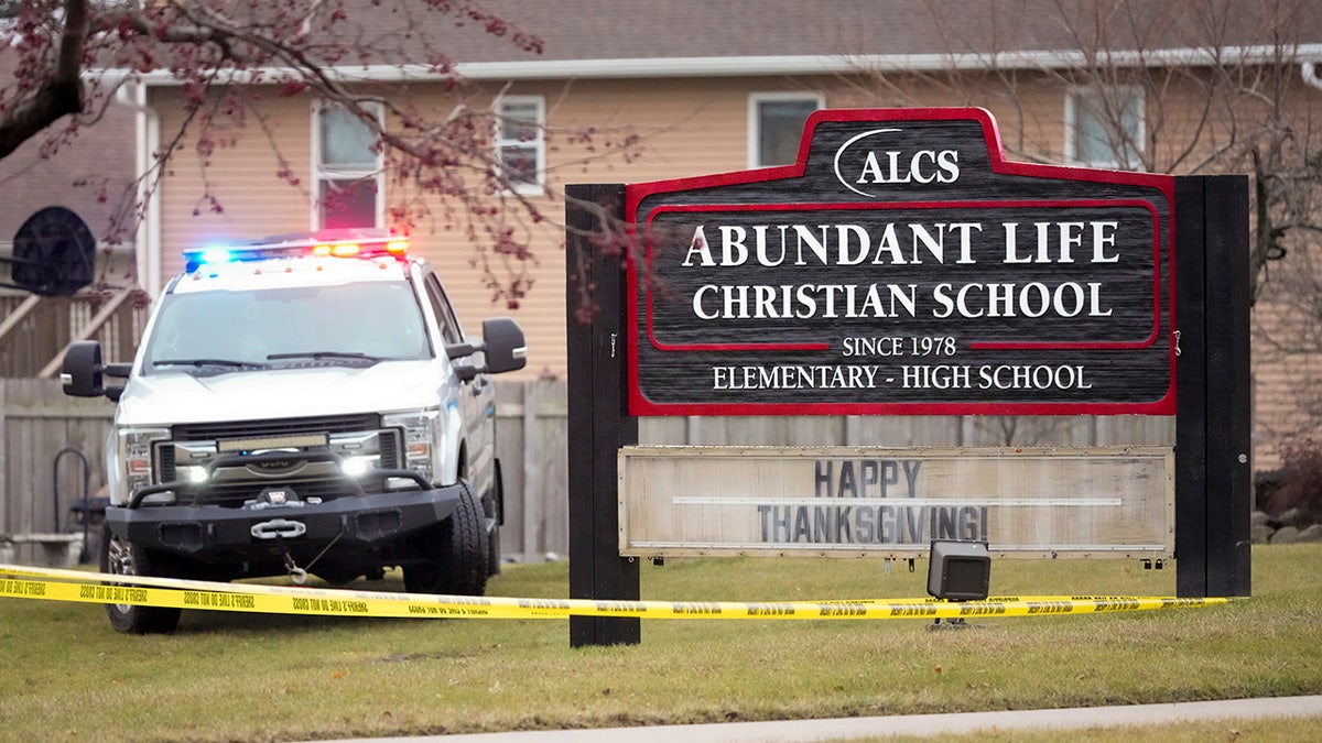 Emergency vehicles are parked outside the Abundant Life Christian School