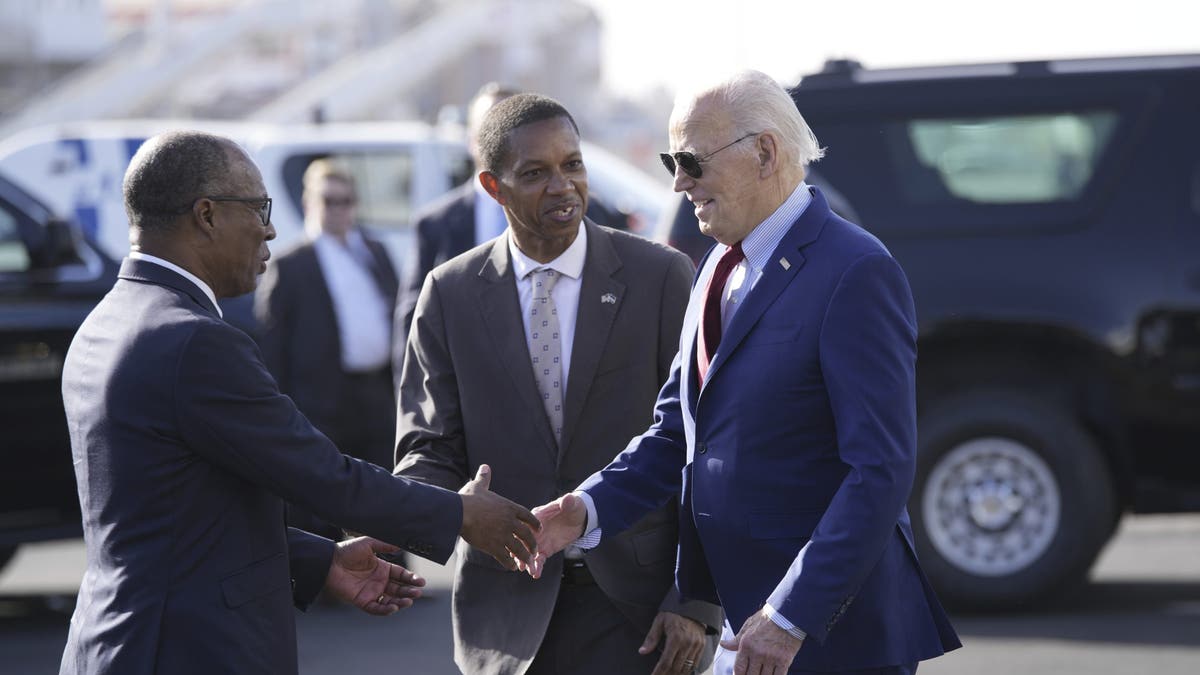 President Biden is greeted by Cape Verde's Prime Minister Ulisses Correia e Silva at Amilcar Cabral international airport on Sal island, Cape Verde Monday, Dec. 2, 2024, en route to Angola as he makes his long-promised visit to Africa. 