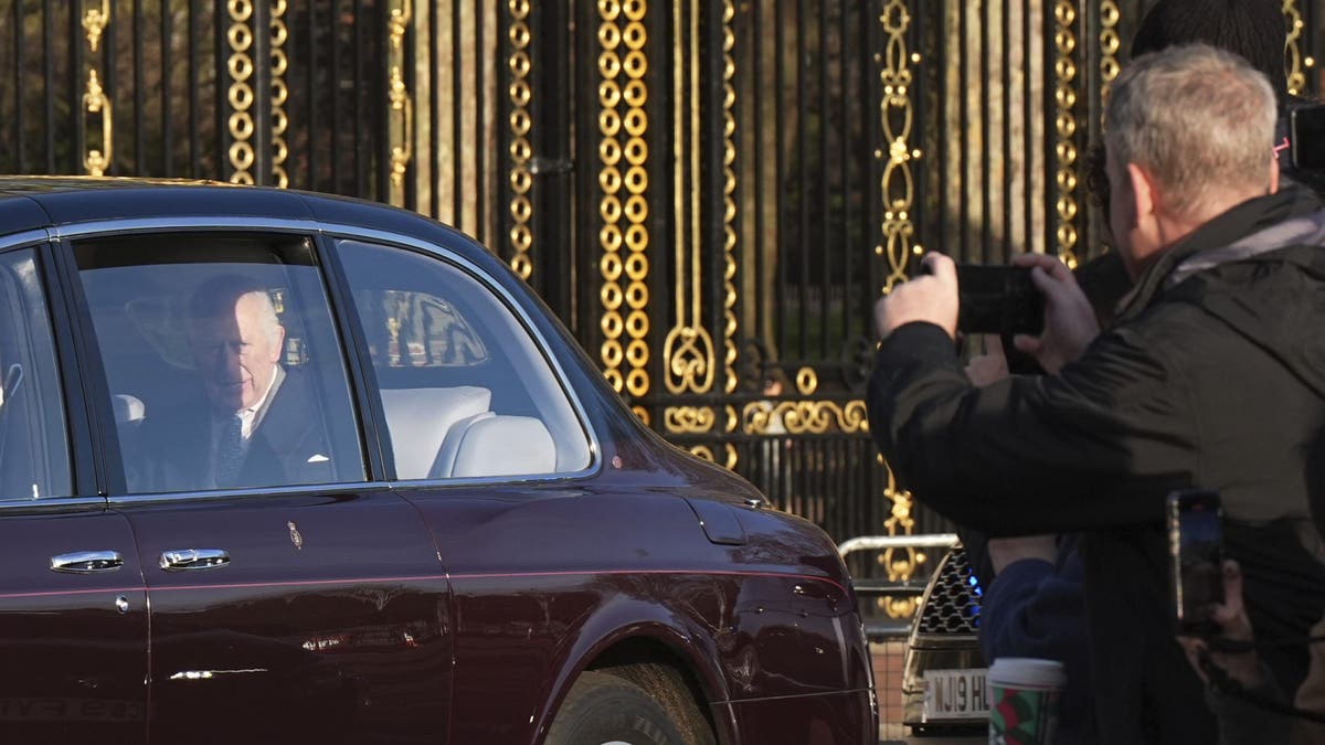 King Charles in car