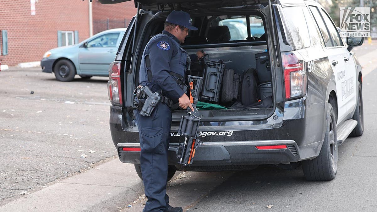 Aurora Police officer gearing up