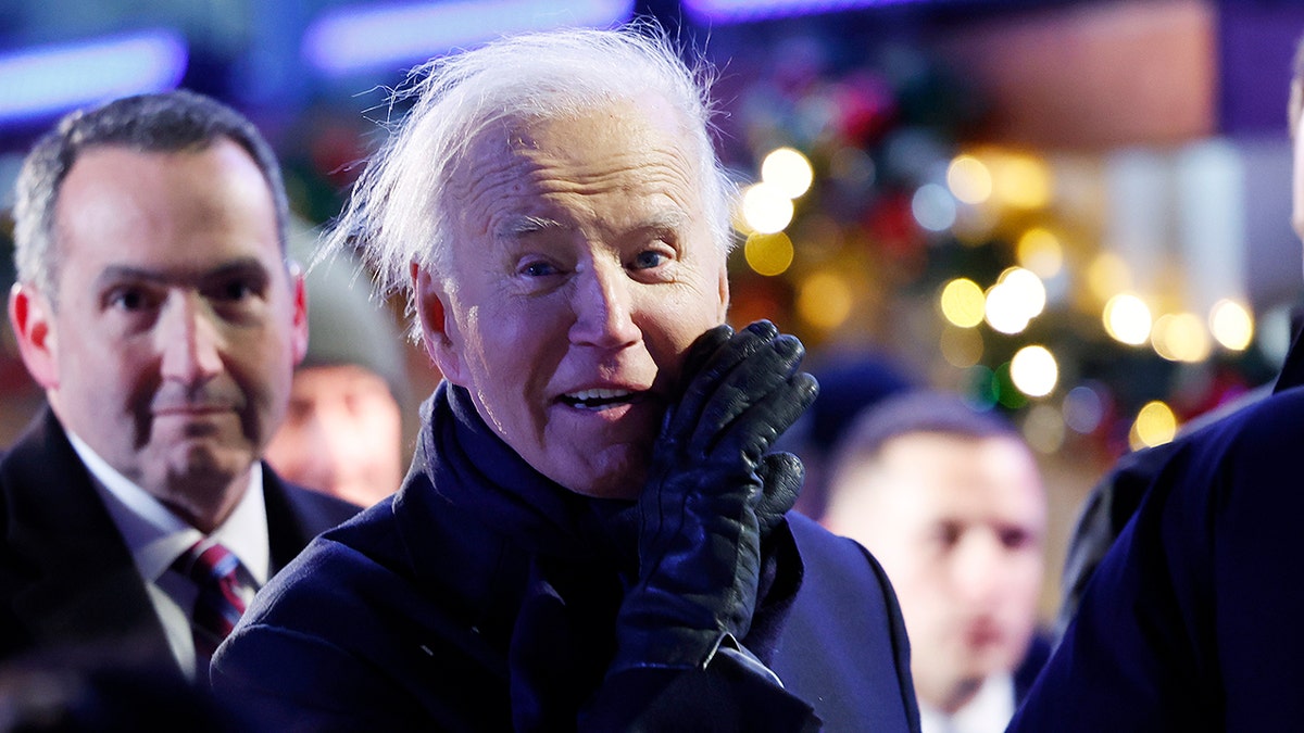 Biden attends national Christmas tree lighting on windy Washington