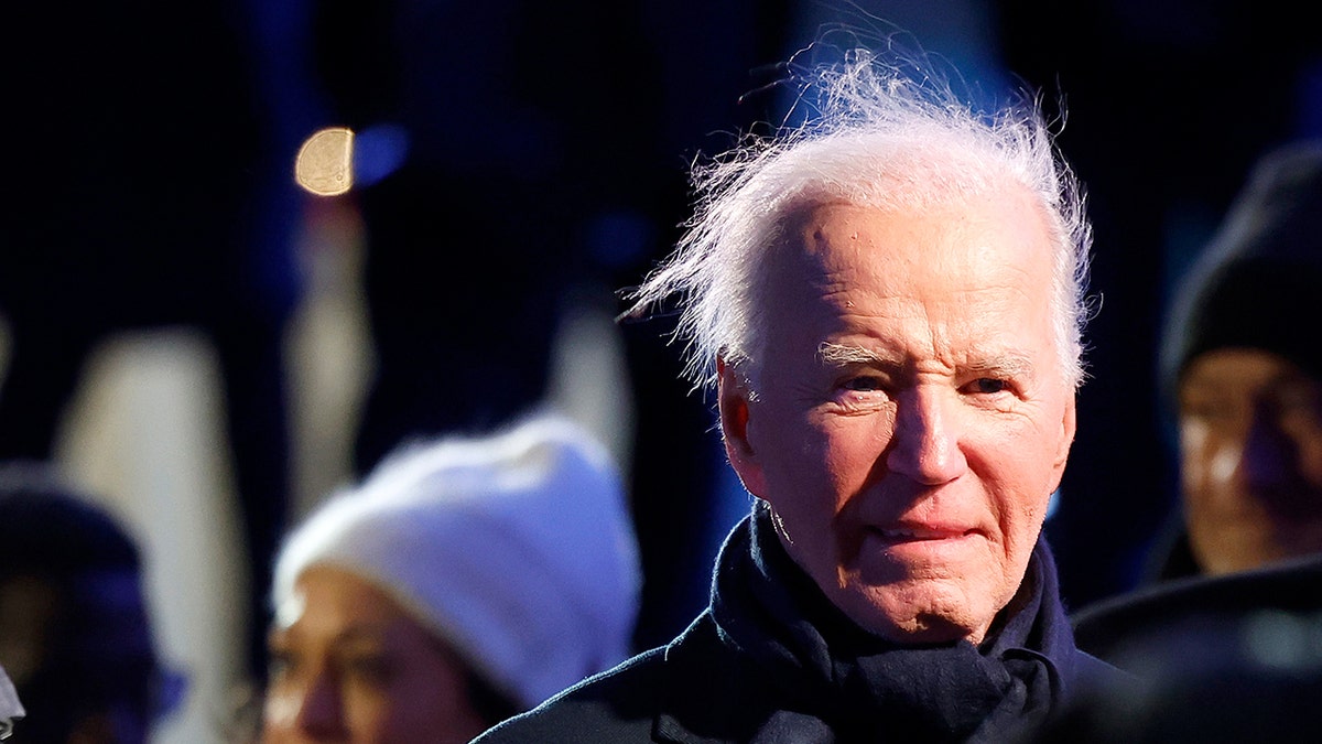 Biden attends national Christmas tree lighting on windy Washington