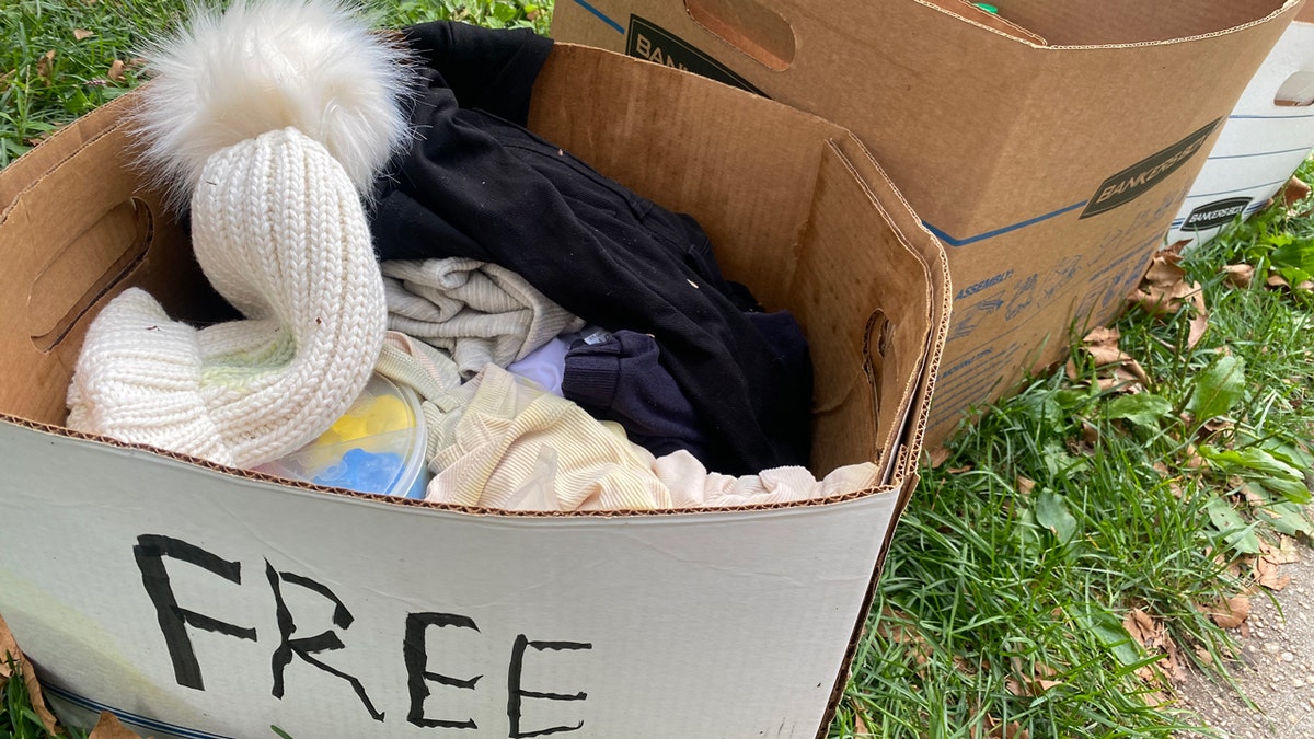 Boxes of clothes labeled "free"