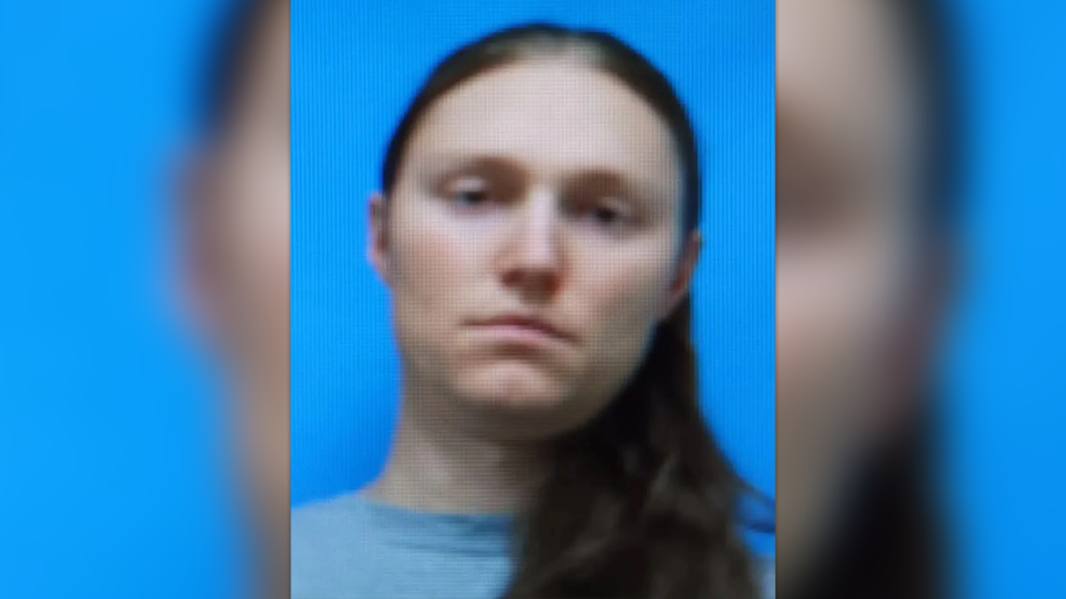 christopher scott williams mug has long hair draped over one shoulder in a prison mugshot