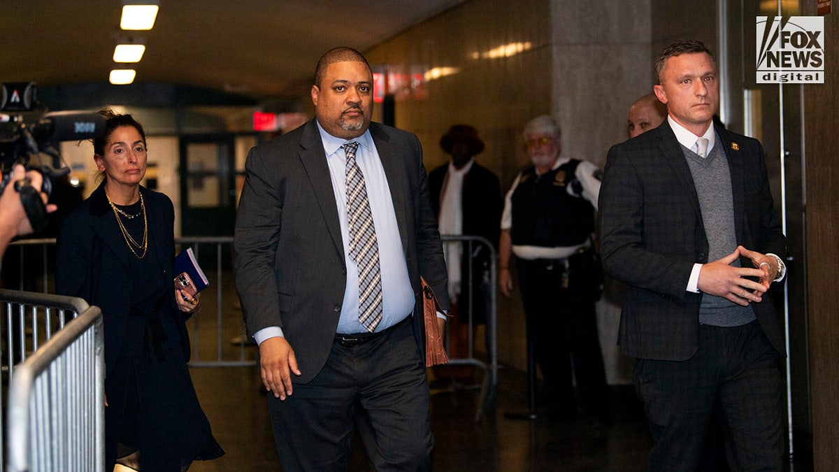 Alvin Bragg walking into court