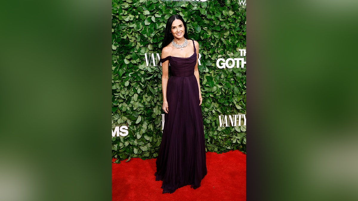 Demi Moore wore a flowy purple dress with an off the shoulder element to the Gotham Awards.