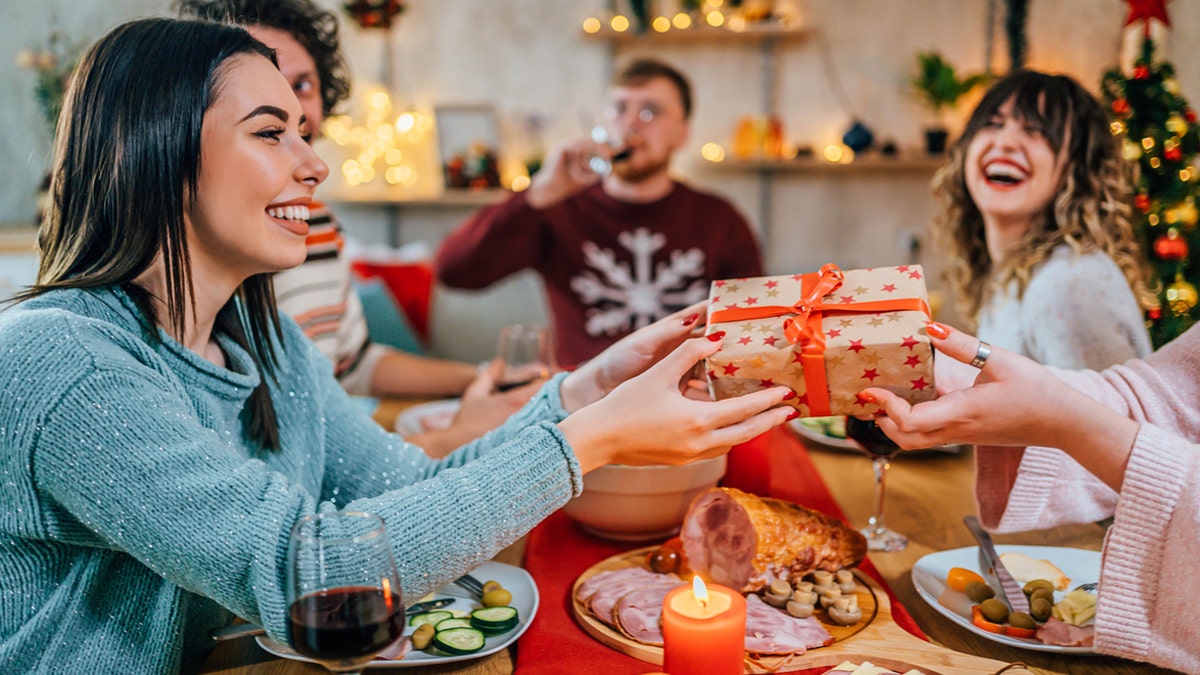 People give Christmas gifts with food.