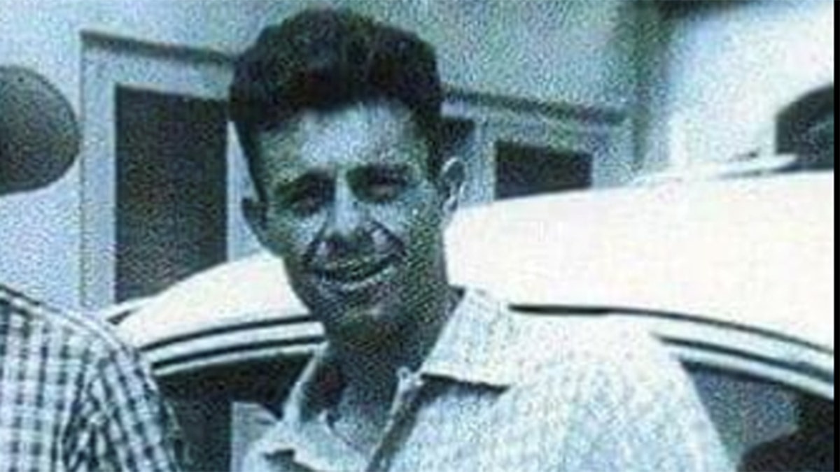 Close-up of Carl Switzer smiling in plaid shirt.