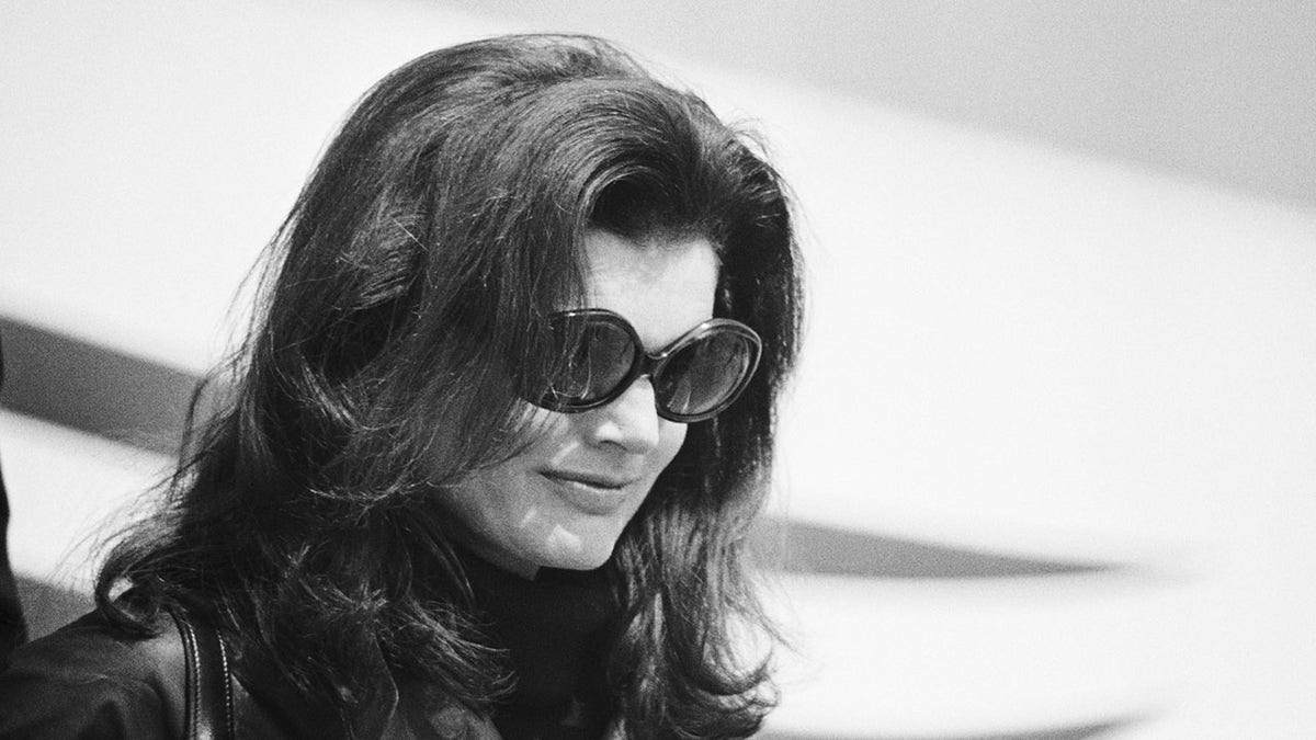 Close-up of Jacqueline Kennedy wearing sunglasses.