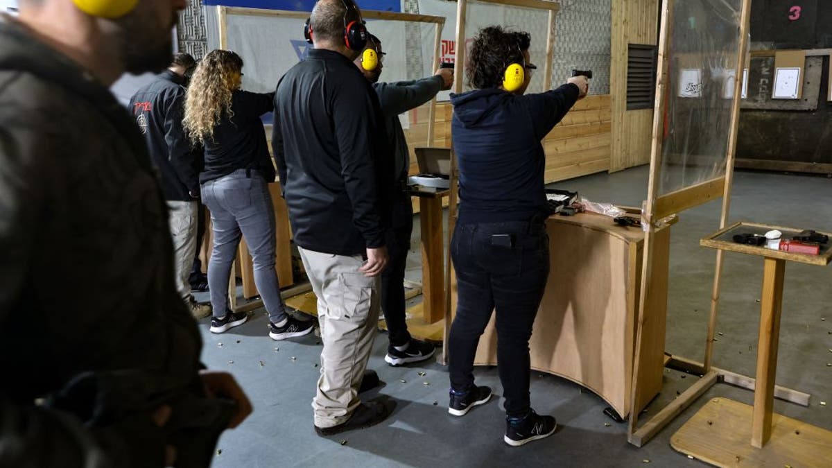 Israelis train at a shooting range