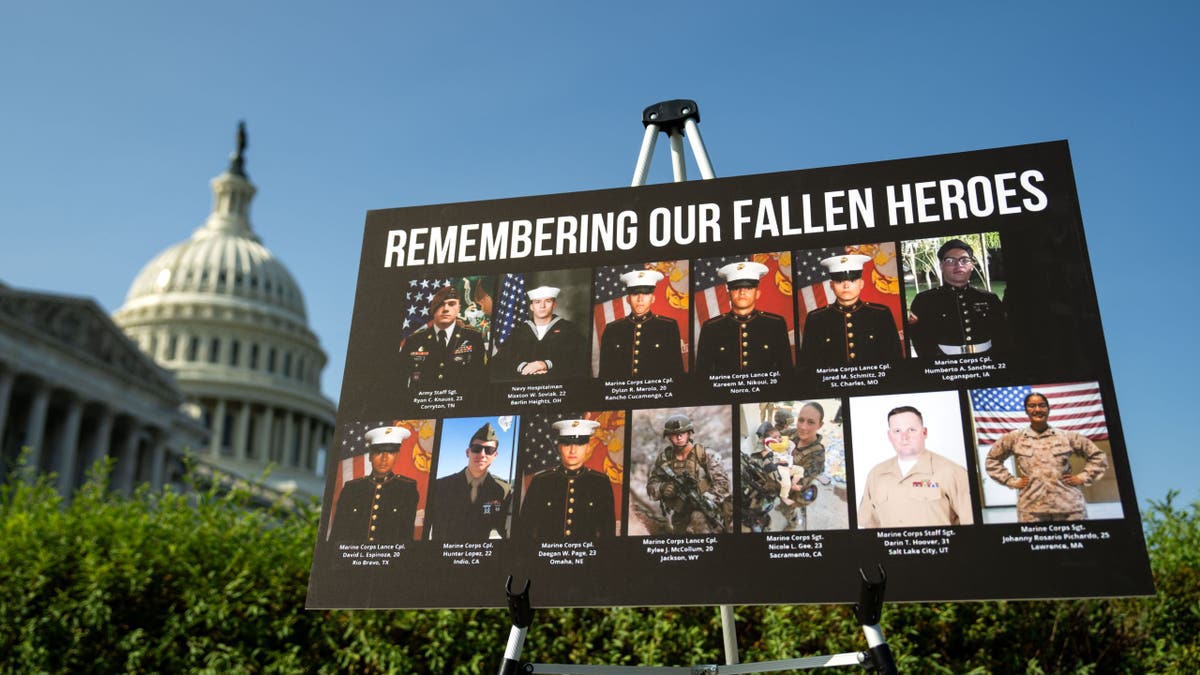 Pictures of the 13 US soldiers killed at Abbey Gate are displayed in front of the US Capitol