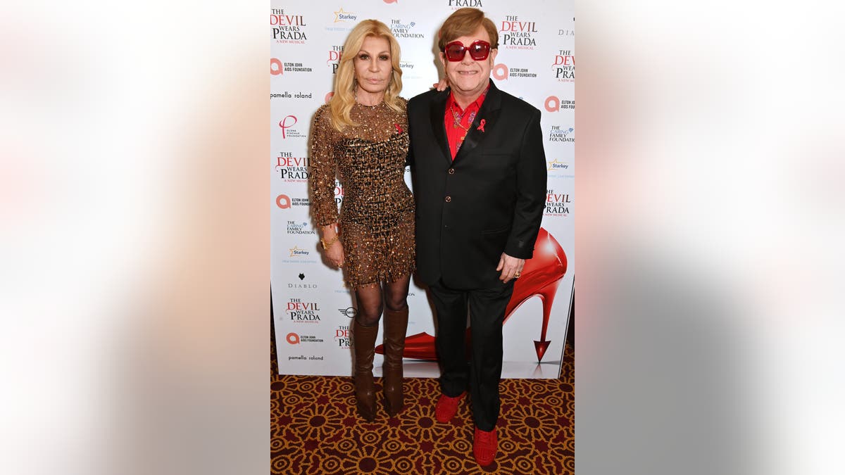 Donatella Versace and Elton John perform together at the premiere