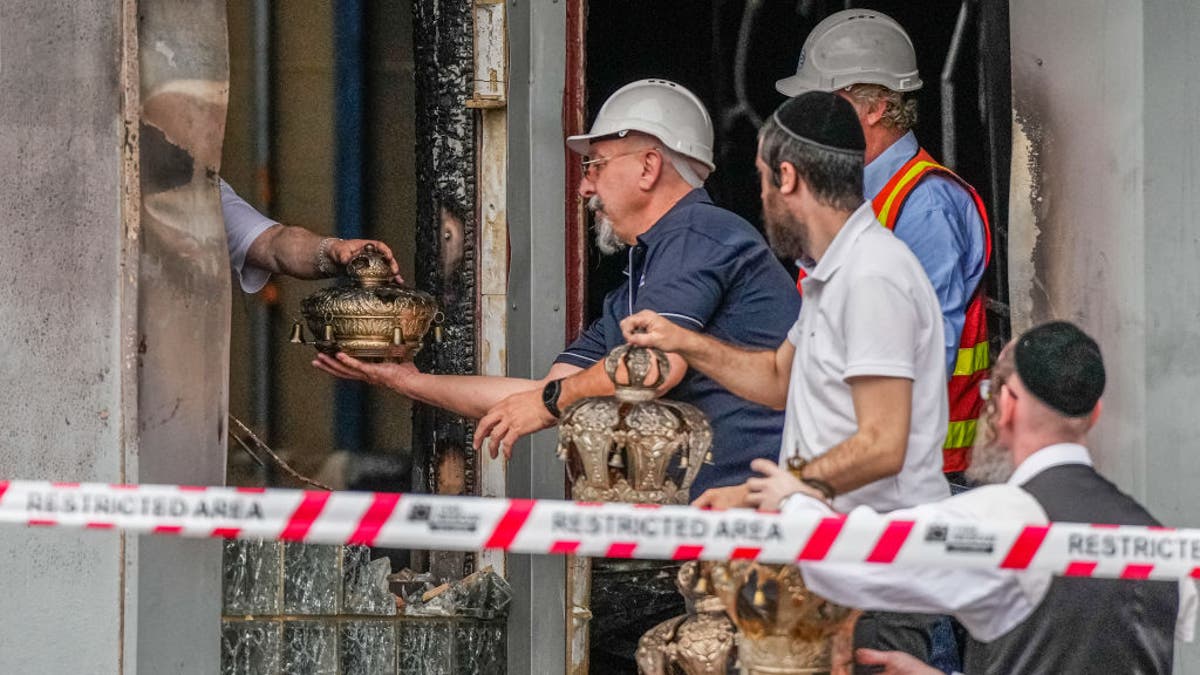 Members of the Synagogue recover items from the Adass Israel Synagogue on December 06, 2024, in Melbourne, Australia after an arson attack.