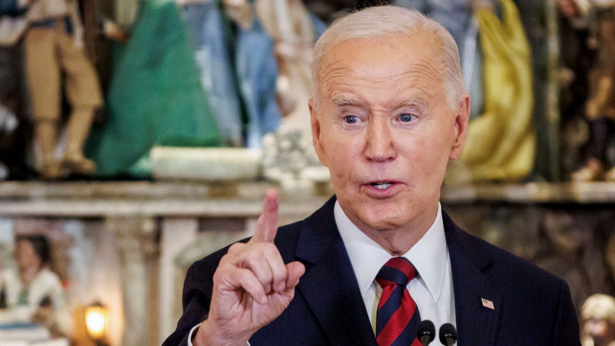 Biden waves his finger at the White House Christmas party