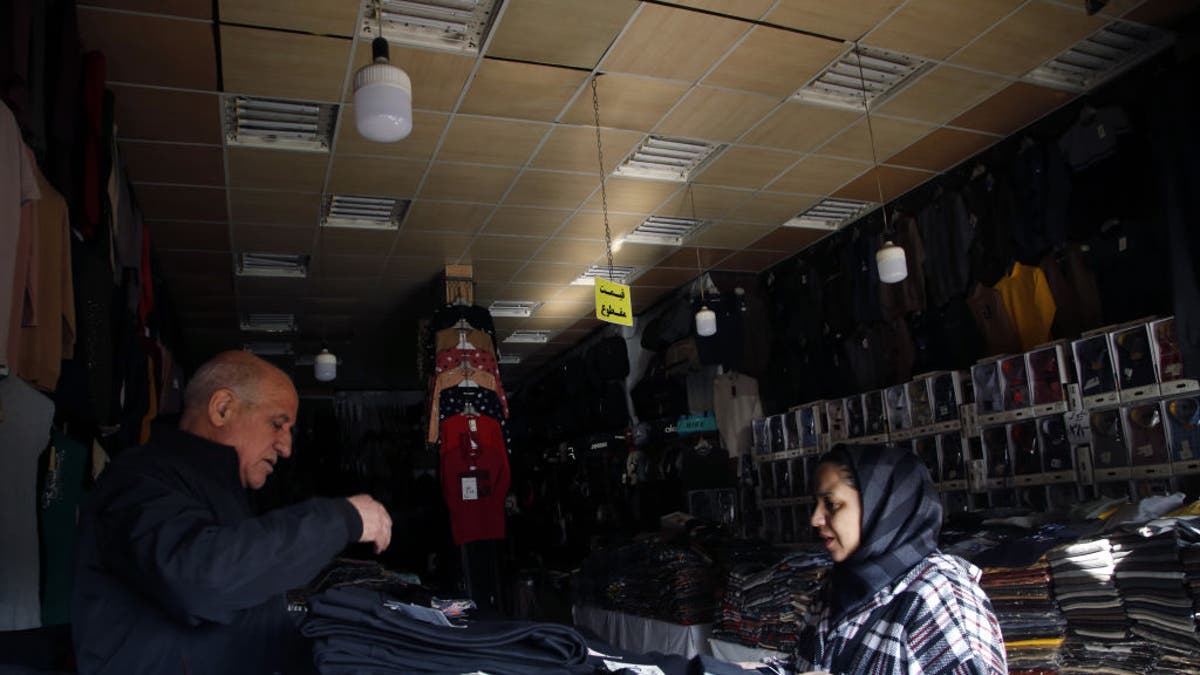 TEHRAN, IRAN - DECEMBER 19, 2024: A view of shops with power outages across the country, including the capital Tehran, Iran on December 19, 2024. In Iran, where electricity supply problems are common, power outages are common and It was witnessed during the summer and extended into the winter this year. Due to the outages, schools and public institutions have been closed in many cities, while online education will continue in some areas.