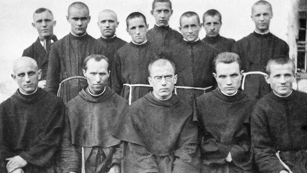 Group of OFM friars, with St. Maximilian Kolbe in the front row in the center.