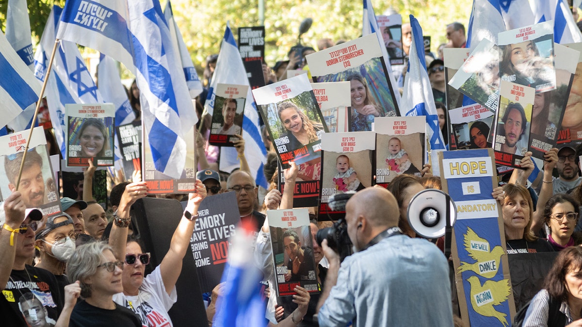 People hold posters of hostages during a rally to mark the first anniversary of the Oct. 7 terror attacks on Israel, on Oct. 6, 2024 in New York City.