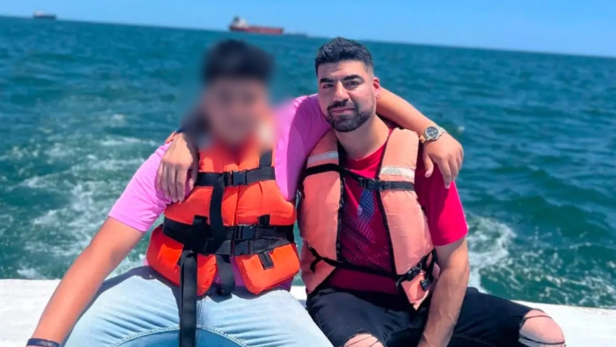 Vicente Peña Jr. and his son on a boat