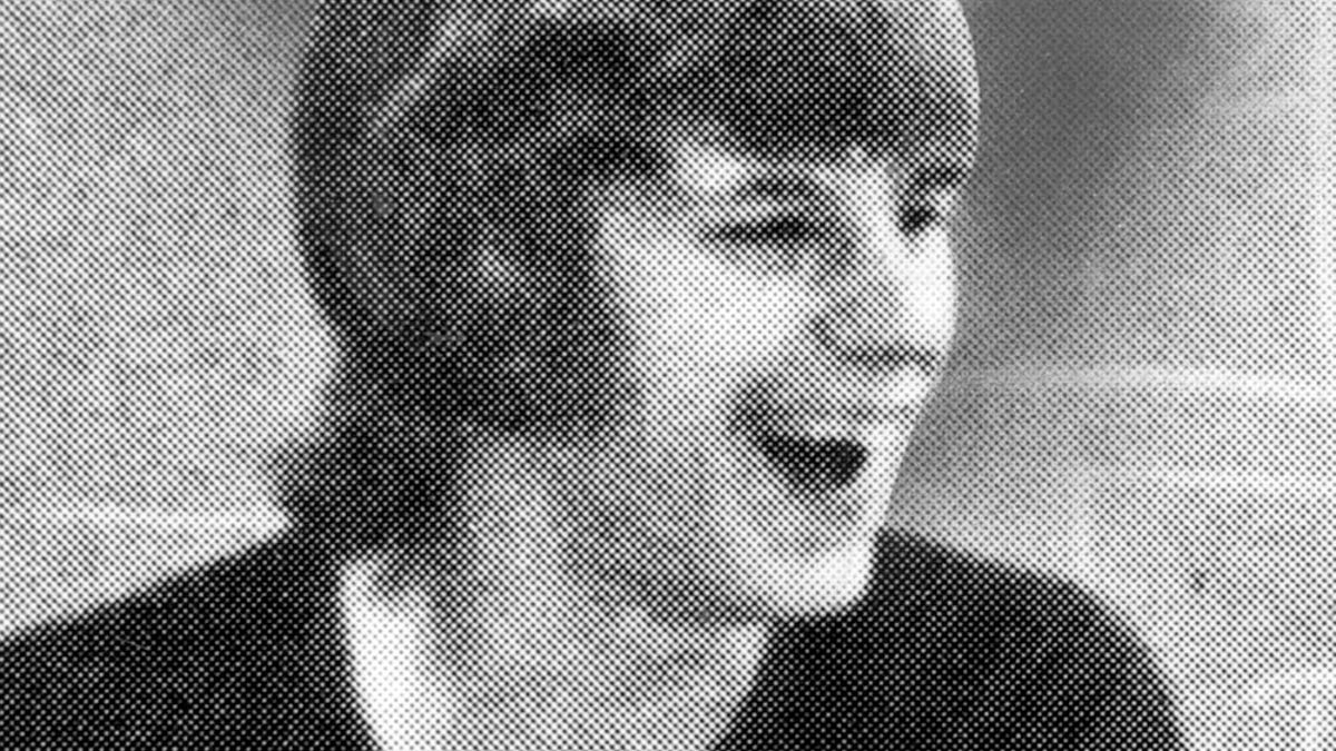 William Lavaco laughing in a black shirt.