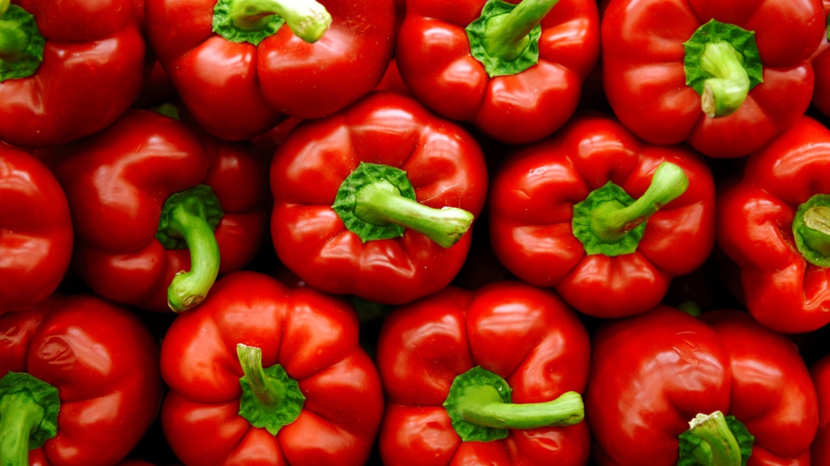 Vibrant stack of red peppers.