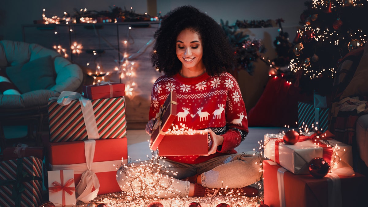 Woman holding a Christmas gift