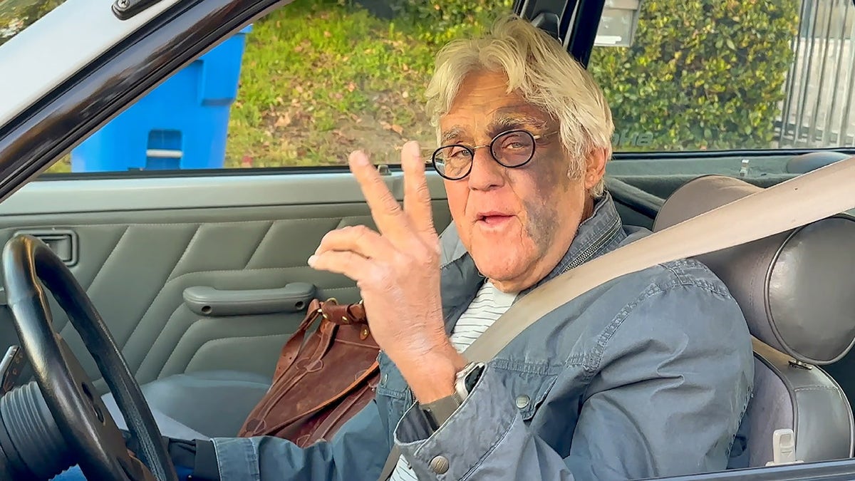 Jay Leno buckles up behind the wheel