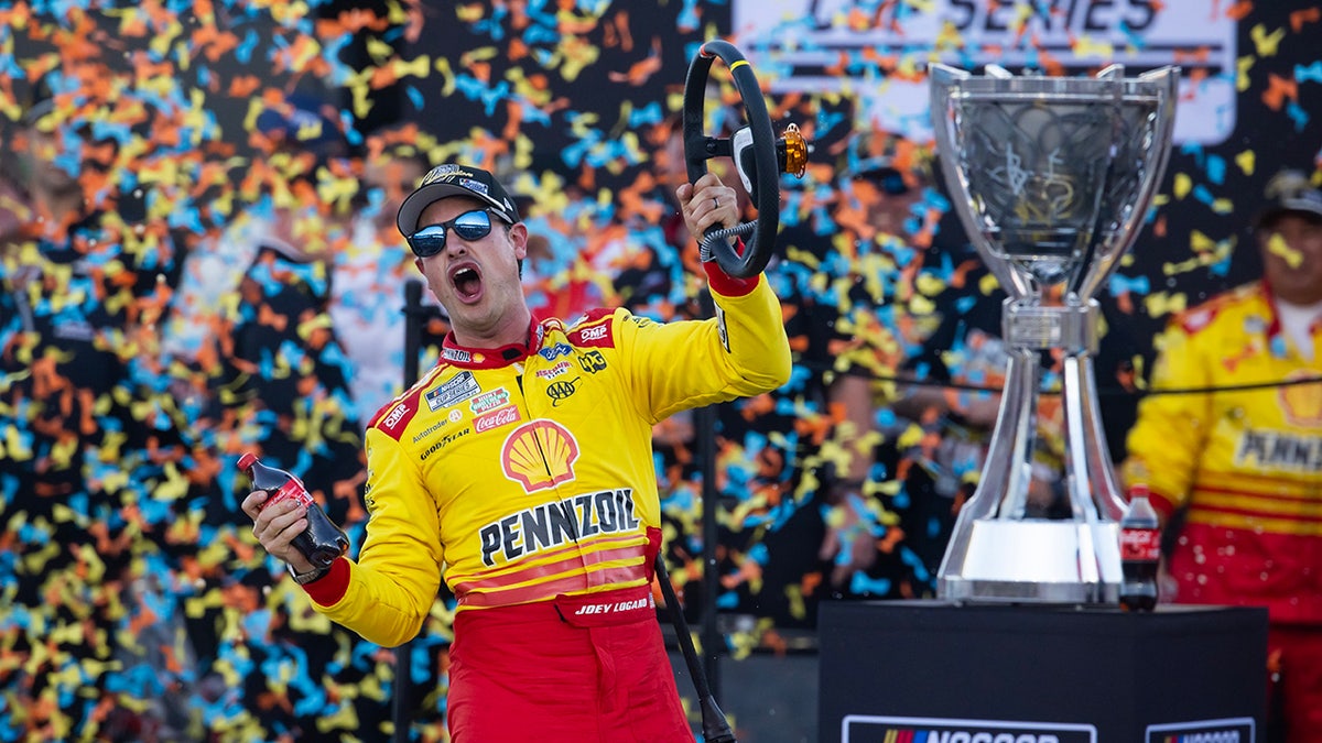 Joey Logano celebrates