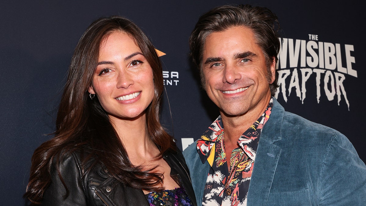 John Stamos with Caitlin at the Invisible Raptor premiere