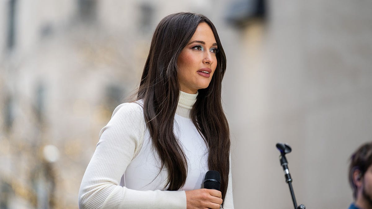 Kacey Musgraves looking serious on stage