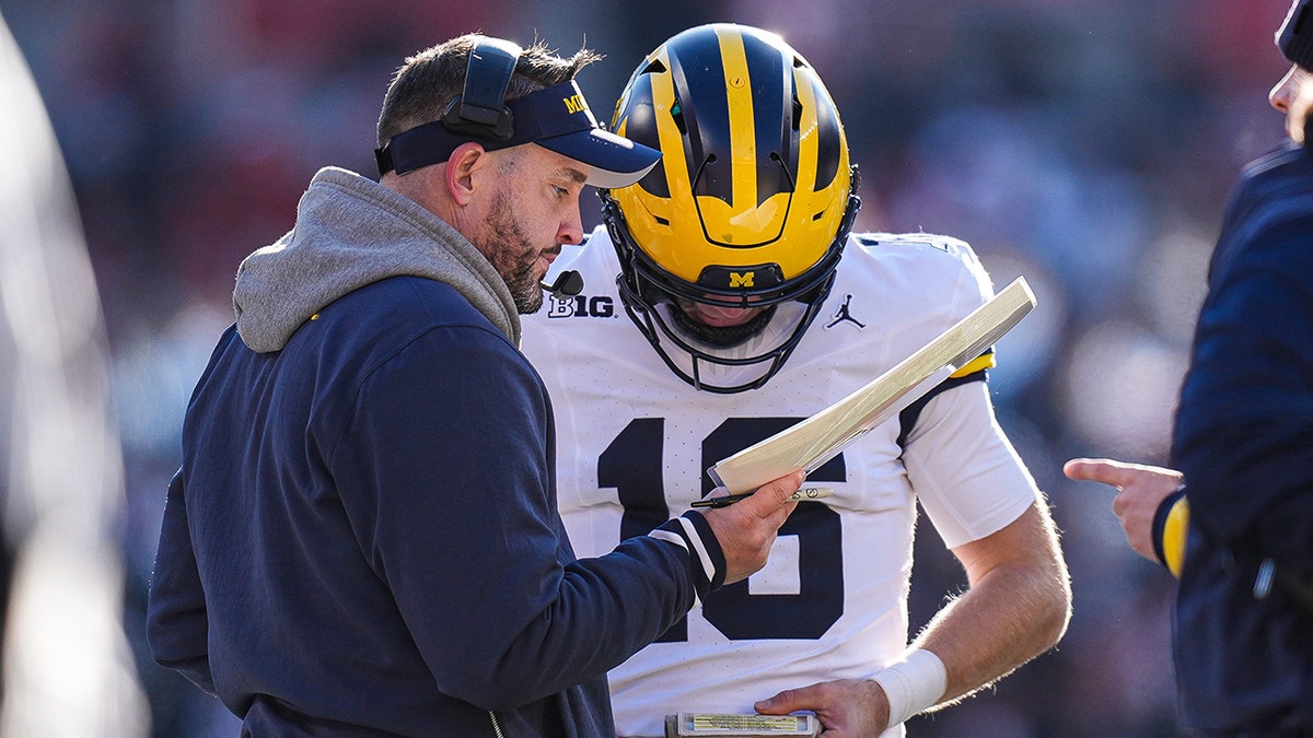 Kirk Campbell talks to the quarterback