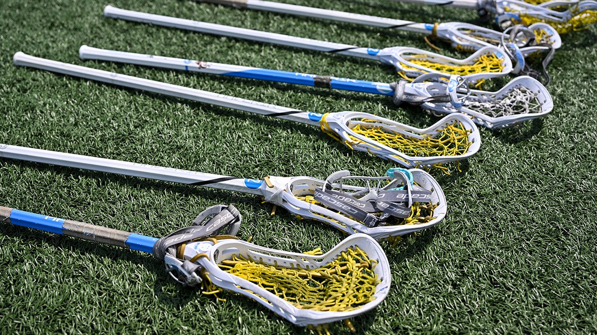 Lacrosse sticks on the field