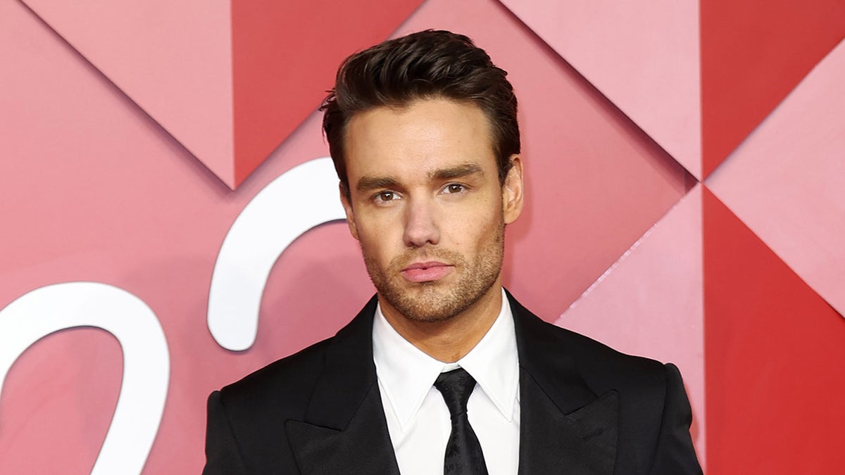 Liam Payne wears black suit and tie at red carpet awards