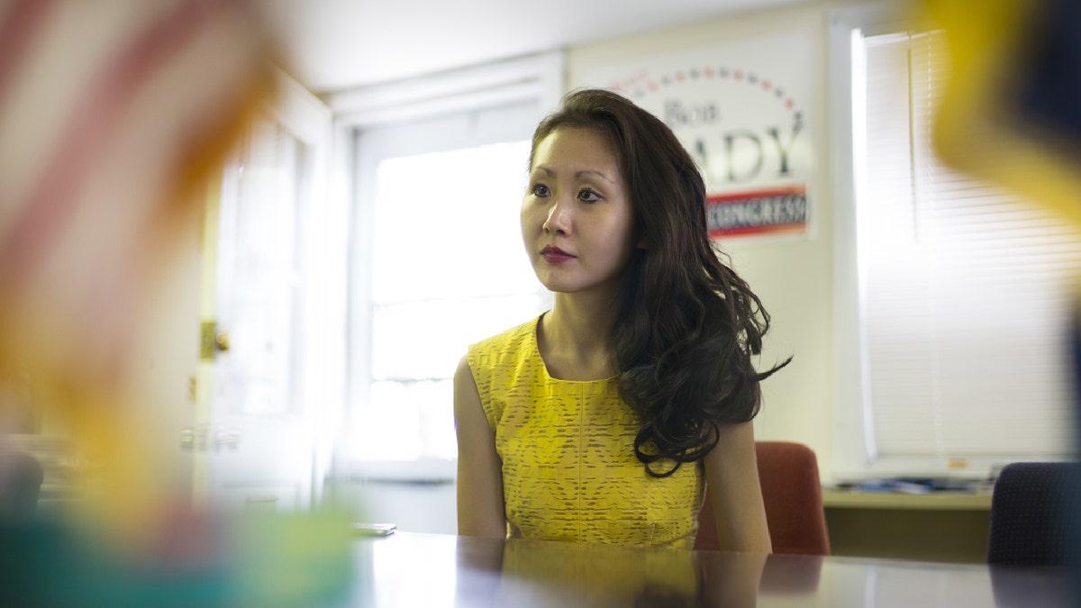 Lindy Li at her desk