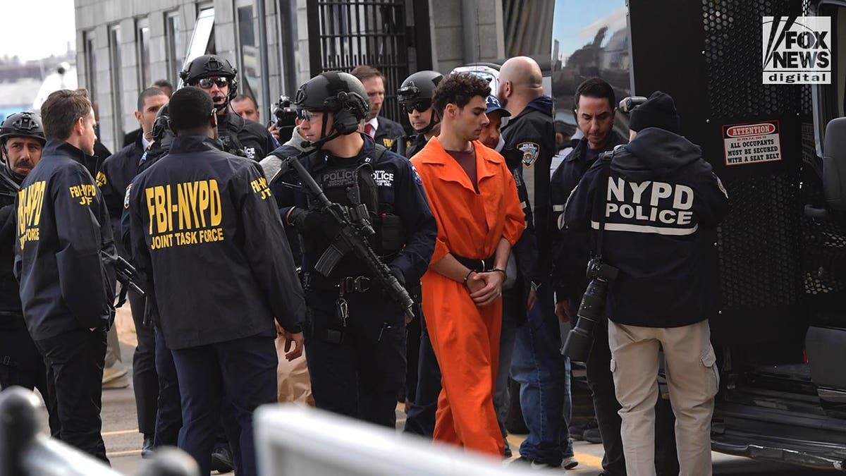 Luigi Mangioni is escorted from an NYPD helicopter in New York City, NY, Thursday, December, 19, 2024. Mangione is the prime suspect in the murder of United Healthcare CEO, Brian Thompson.