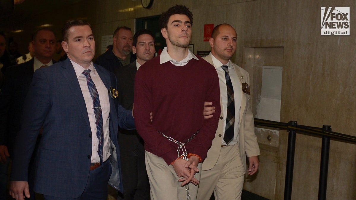 Luigi Mangione enters the courtroom of the New York Criminal Court