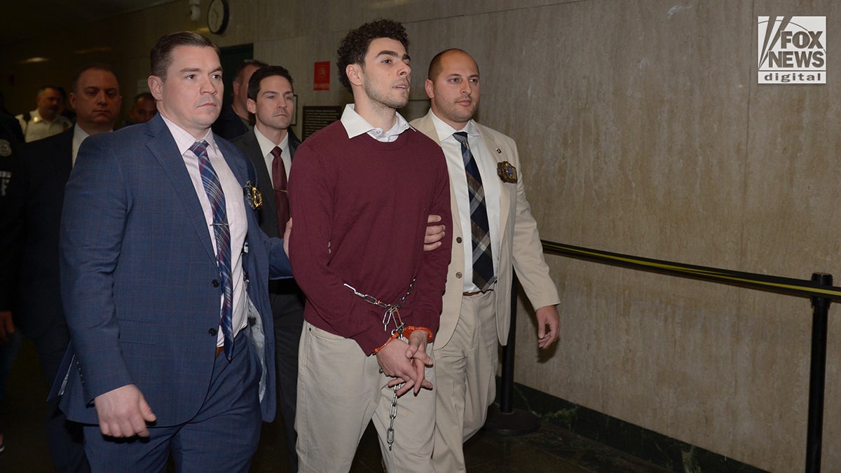 Luigi Mangione enters the courtroom in New York City Criminal Court