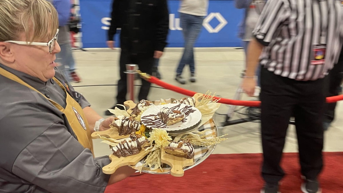 Misti Stowers balances a tray of her Possum Pies during the World Food Championships in Indianapolis.