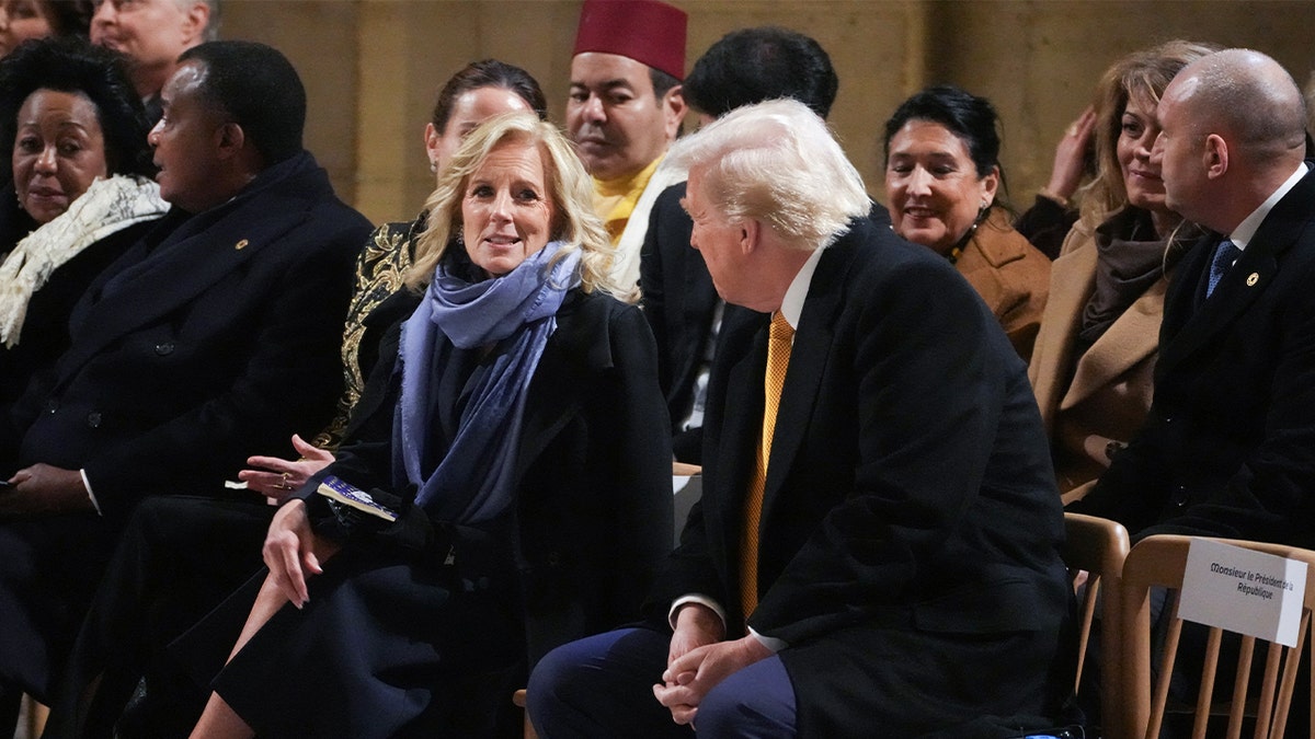 First Lady Jill Biden (CL) speaks with President-elect Donald Trump during a ceremony marking the reopening of Notre Dame Cathedral, a landmark in central Paris, on December 7, 2024. 