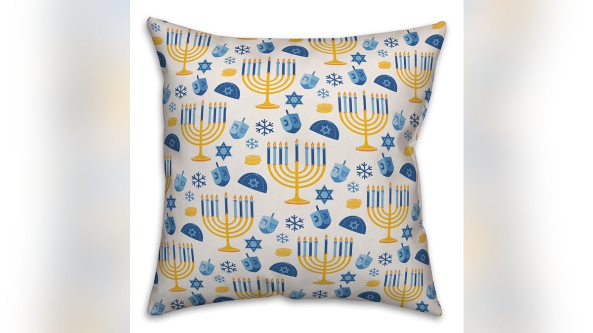 Add a few throw pillows to your couch or bed. 