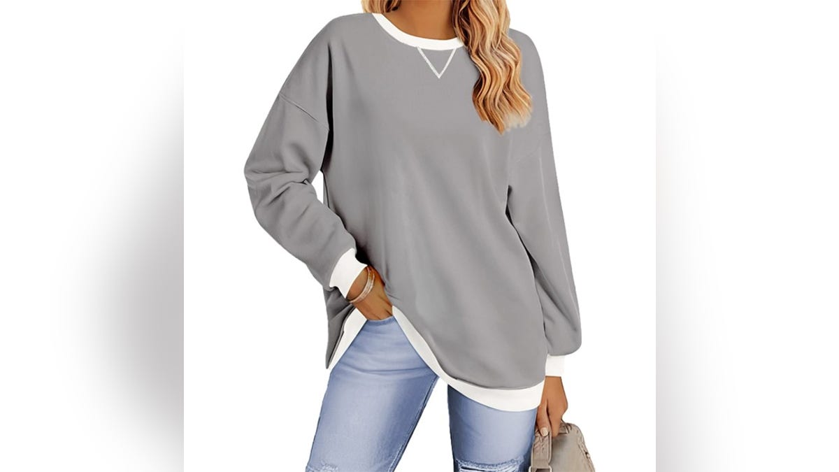 Stay cozy with an oversized sweatshirt. 