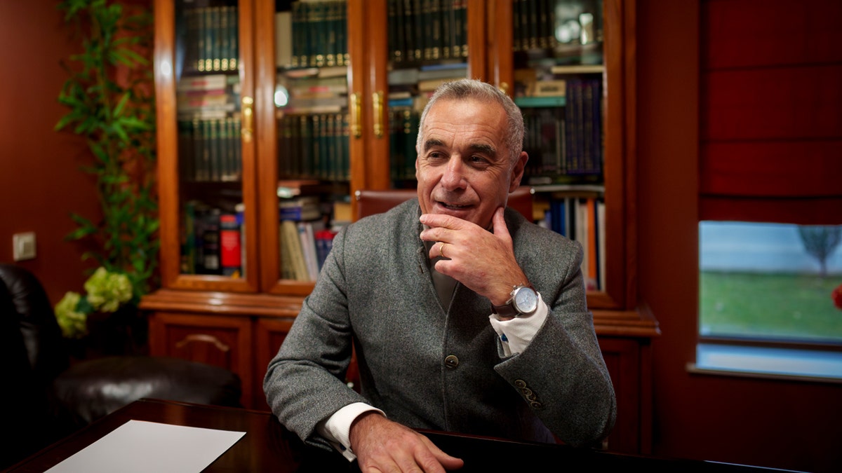 The President's Romanian candidate sits on a table of Jalin Georgescu.