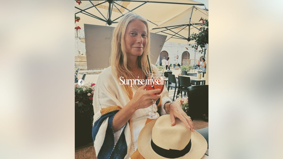 Gwyneth Paltrow holding a drink