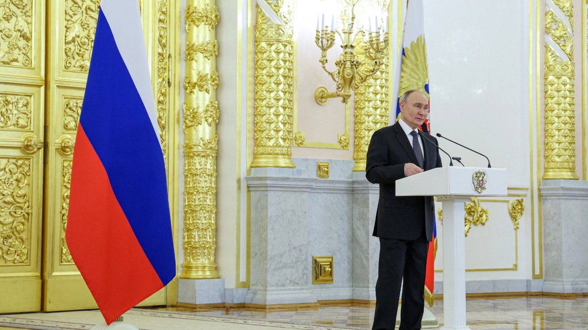 Vladimir Putin at lectern